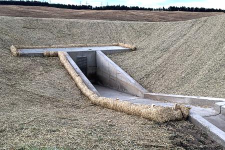 Installed erosion control blanket and straw waddles in Colorado Springs, Colorado