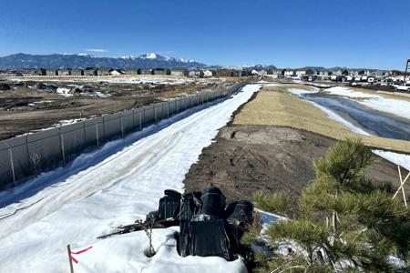 Erosion control in Black Forest, Colorado installing silt fence and erosion control blankets in and on this pond for stabalization