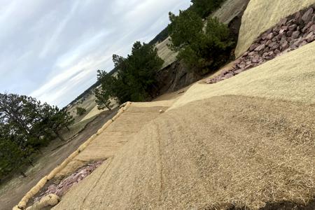 Erosion Control Black Forest, Colorado. Installed erosion control blanket and waddles on this slope to help stabilize the soil, help with seed germination and the straw waddles were installed to help keep the dirt from upstream transferring onto the erosion control blanket.
