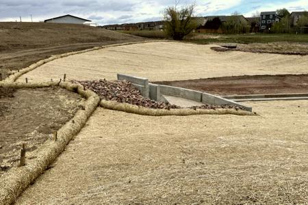 Erosion control in Colorado Springs. Erosion control in Colorado Springs, installed erosion control blankets to keep the seed bedded down, keep the dirt from moving in a rain storm and help the grass seed to germinate. The straw waddles were installed to prevent the dirt from up stream moving down onto the erosion blanket