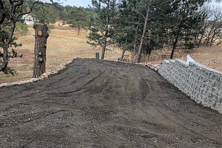Installed a segmental retaining wall and a crushed asphalt driveway in Monument, Colorado