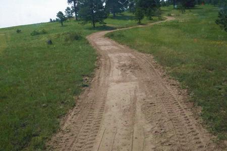 Excavating in Black Forest, Colorado a trail system in a development for the people to walk and run on