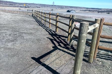 Fencing in Larkspur, Colorado so that the cows do not escape.