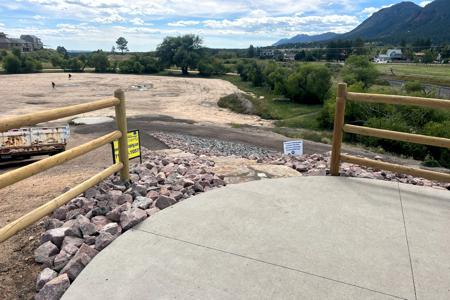 Landscape Palmer Lake, Colorado the installation of fencing, 2 sets of Siloam Stone stairs and landscape rock that will lead you down to the lower trail systems around Palmer Lake, lake