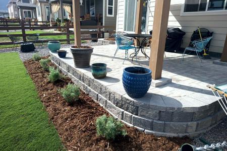 Landscape Monument, Colorado. Installed a segmental retaining wall, paver patio and landscaping on a home in Monument, for their backyard.
