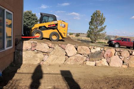 Retaining wall built for erosion control and to create a more workable yard for curb appeal in Colorado Springs