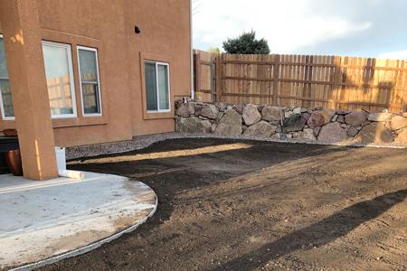 Boulder retaining wall for a client using their own boulders in Colorado Springs, Colorado