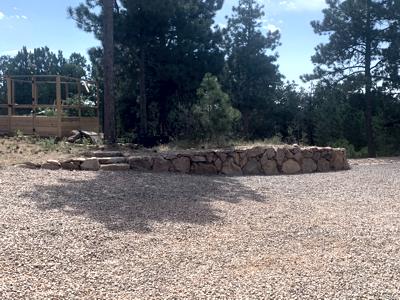Boulder retaining wall to stop erosion in Black Forest Colorado